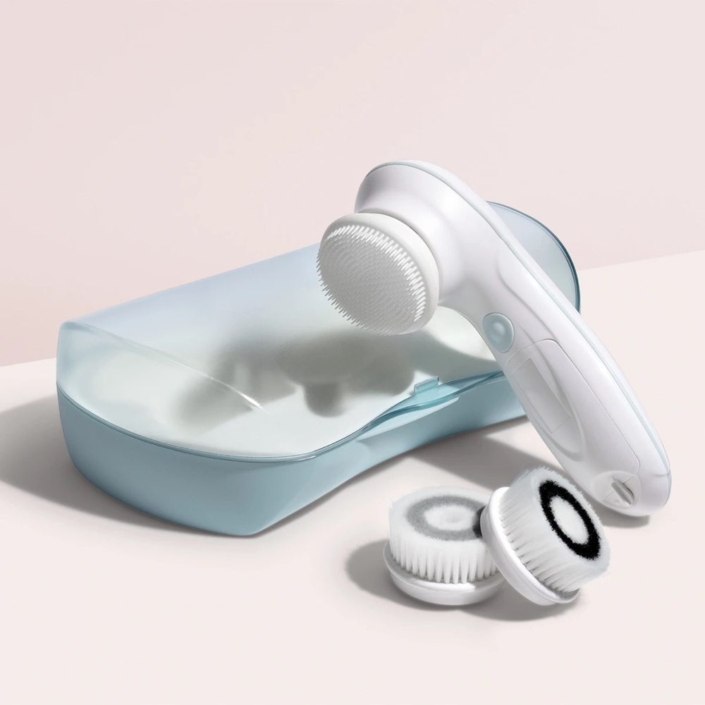 Electric blue facial cleansing brush